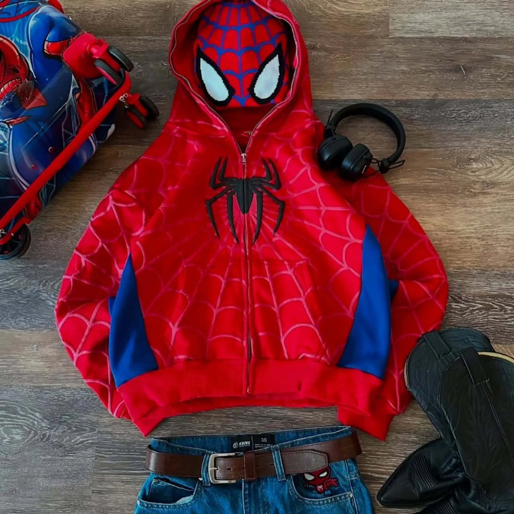 Spider-Man hoodie on a wooden floor with toys and shoes around