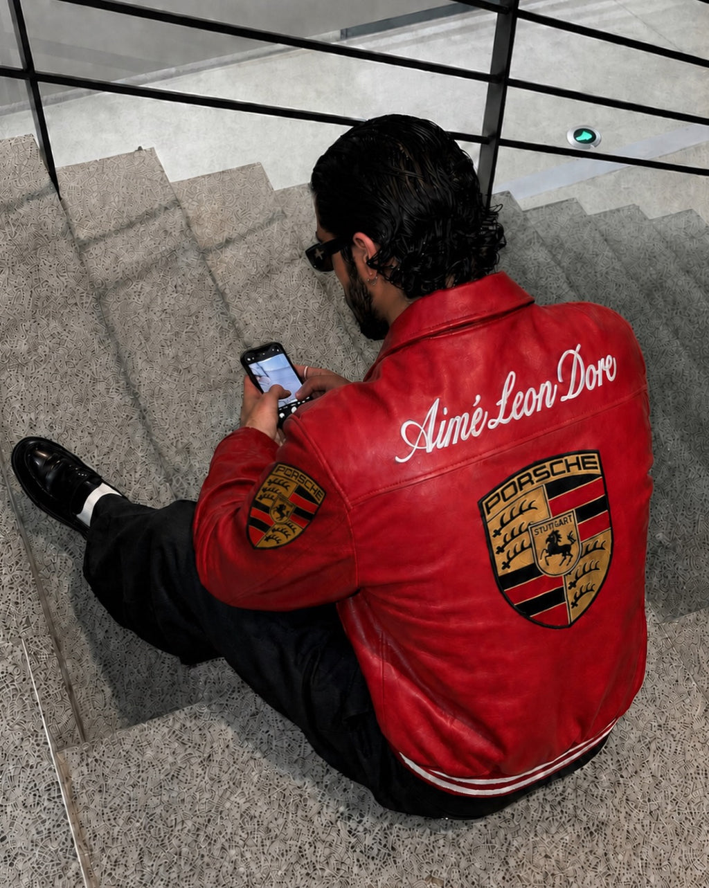 Close-up of high-quality embroidered patches on Red 993 Racing Leather Jacket.